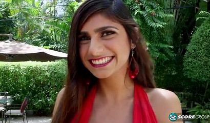 Busty Muslim vixen Mia Khalifa shows off her cock sucking skills poolside