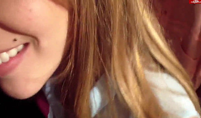 Amateur brunette sucking her man's boner in the changing room