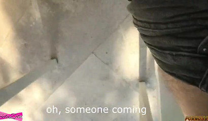 Brunette student kneel beneath the outdoor desk and blows cock