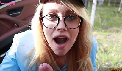 Russian girlfriend with sexy eyeglasses blowing off her boyfriend in the car
