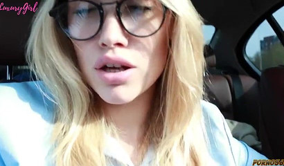 Russian girlfriend with sexy eyeglasses blowing off her boyfriend in the car