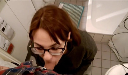 Brunette slut with glasses sucks dick in supermarket's toilet