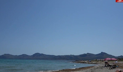 Hottie in black bikini sucking her boyfriend's fat dick on the beach