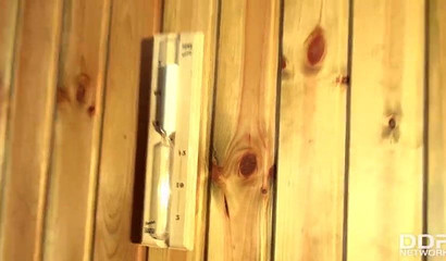 Blonde bombshell Kathia Nobili blowing huge dick in sauna