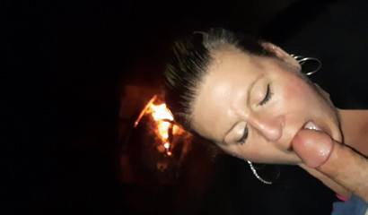 Blonde MILF Swallows Cum by the Fire