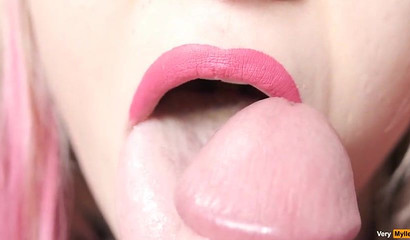 Close-up of Very Myller's pierced tongue slowly licking a cock