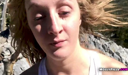 Horny hikers Molly Pills strips and blows a dick in the mountains