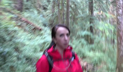 Horny brunette knees down and gives a BJ in the woods