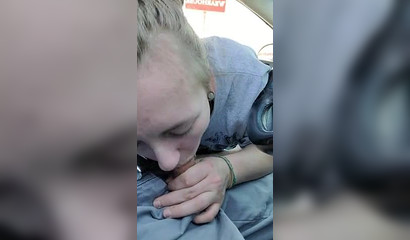 Blonde giving me oral pleasure in the car on the parking lot