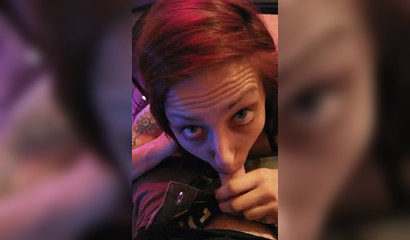 Redhead gamer girl rests her trigger finger by sucking her man's penis