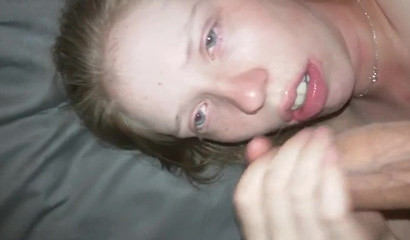 Slutty amateur girl worships a huge dick and receives jizz on her face