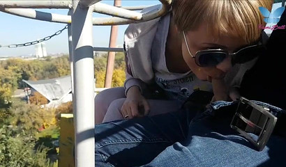 An exciting ferris wheel blowjob recorded as the ride is in session