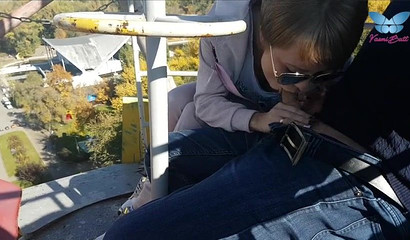 An exciting ferris wheel blowjob recorded as the ride is in session