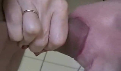 Short-haired MILF gives me a dirty look while sucking my cock