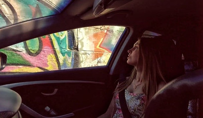 Sasha Paradise leans over and starts sucking the dude who is driving