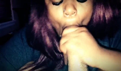 Enticing ebony goddess giving her man a sloppy blowjob