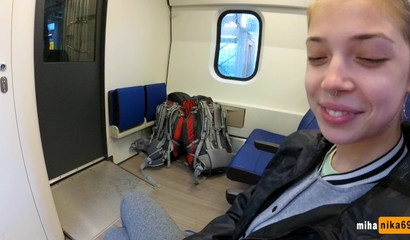 European slut reaches over and performs a public train blowjob