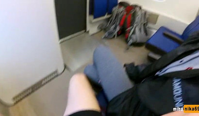 European slut reaches over and performs a public train blowjob