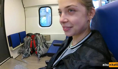 European slut reaches over and performs a public train blowjob