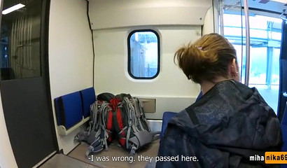 European slut reaches over and performs a public train blowjob