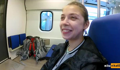 European slut reaches over and performs a public train blowjob