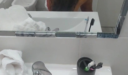 A fierce brunette milf eats hot delicious cum in the bathroom