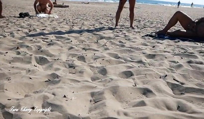 Intense beach blowbang with skinny Cap d'Agde and a couple of large dicks