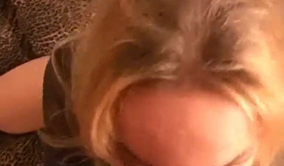 Passionate blonde lady in black outfit giving amazing head