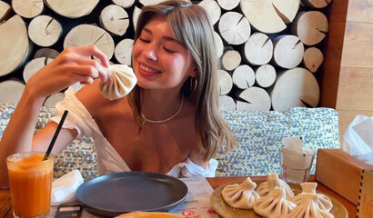 Anya Ralphs gets a facial for a plate of khinkali.