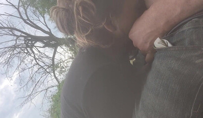 Amateur Brunette MILF Deepthroats Outdoors by the River