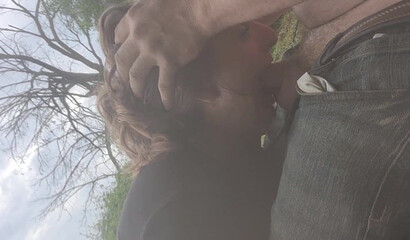 Amateur Brunette MILF Deepthroats Outdoors by the River