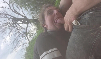 Amateur Brunette MILF Deepthroats Outdoors by the River