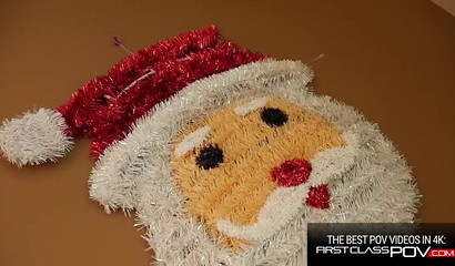 Busty elf Jessa Rhodes blowing off horny Santa Claus in POV