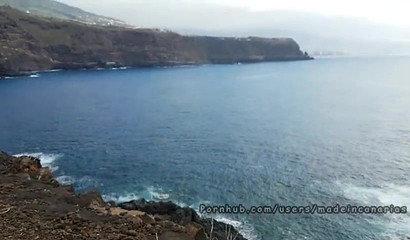 Busty Latina with sunglasses giving fantastic BJ on the beach