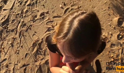 Irresistible blue eyed girl sucks knob on beach day