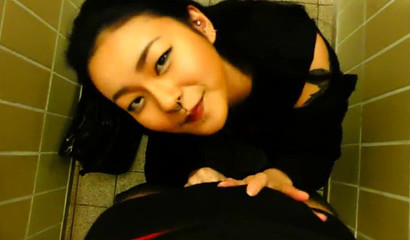 Ho Asian doll Rae Lil Black gives oral pleasure in the public toilet
