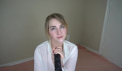 Beautiful solo babe shoves a dildo down her throat