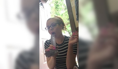 While the door is open the blonde deepthroats her toy