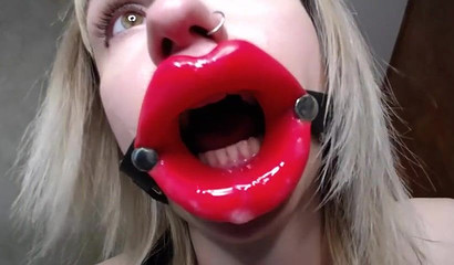 Slutty blonde takes her extremely large dildo and deepthroats it