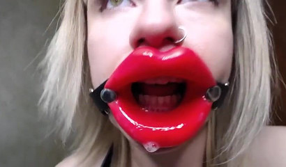 Slutty blonde takes her extremely large dildo and deepthroats it