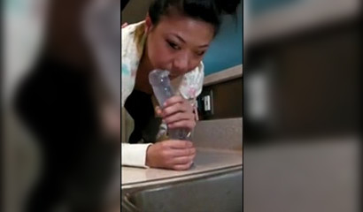 Amateur slut jumps on a counter to suck a dildo