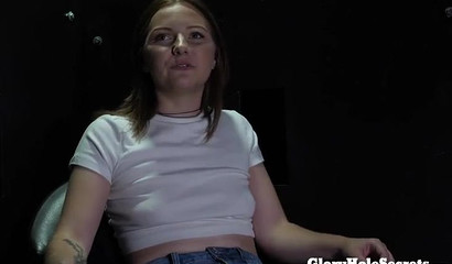 Teen redhead spitting on dicks in a glory hole room