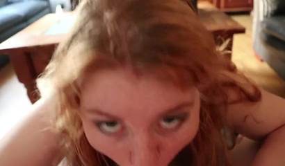 Redhead teen exposing her big boobs during an intense blowjob