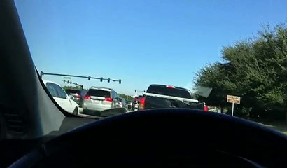 Cute brunette giving me head while driving on a highway