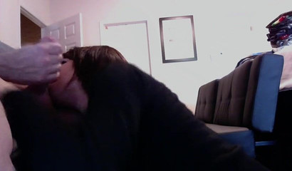 Slutty brunette cutie sucking off her man while he works