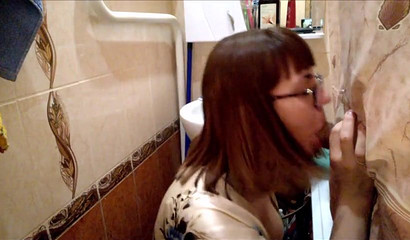 Teacher with eyeglasses gives me a blowjob in the bathroom