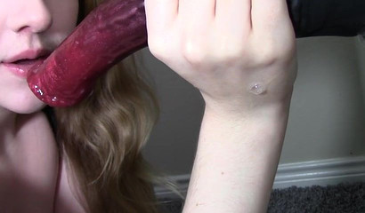 Cock gobbler sucking on a fake horse cock for her fans